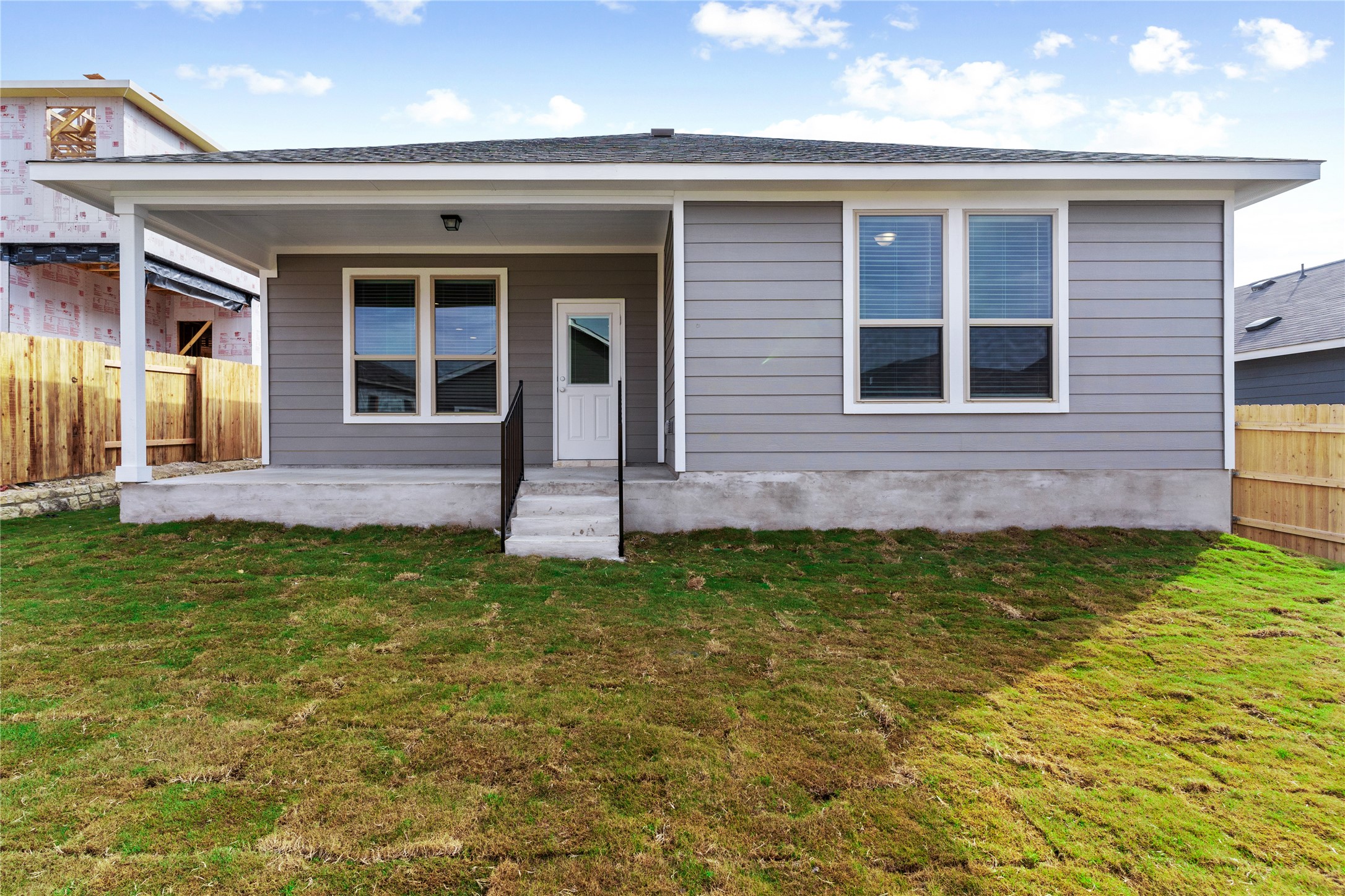 313 Mclintock Road Jarrell, TX 76537 - Photo 17 of 17 A private rear patio extends into a verdant lawn, ideal for outdoor leisure.