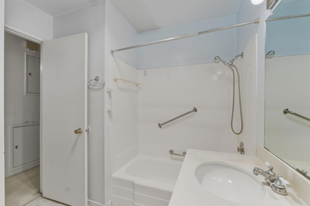 3592 Boussock Lane Oceanside, CA 92057 - Photo 17 of 24 a bathroom with a granite countertop shower sink vanity and mirror