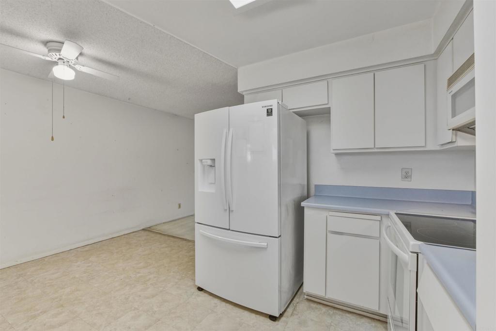 3592 Boussock Lane Oceanside, CA 92057 - Photo 8 of 24 a white refrigerator freezer sitting inside of a kitchen