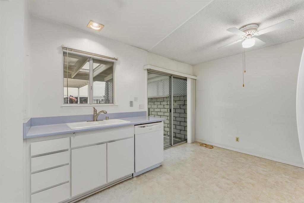 3592 Boussock Lane Oceanside, CA 92057 - Photo 9 of 24 a bathroom with a granite countertop sink and a mirror