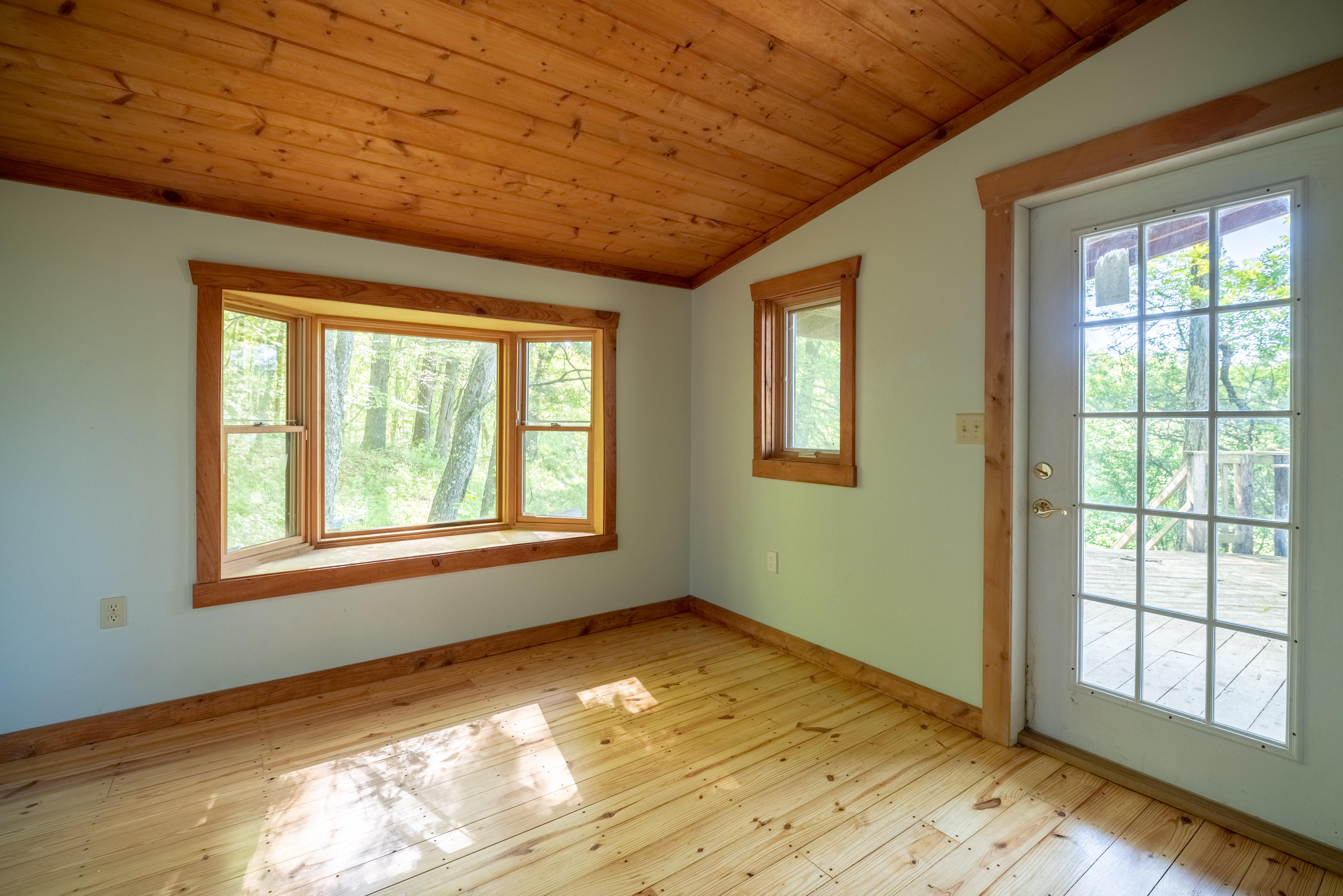 483 Eanes Road Northeast Check, VA 24072 - Photo 14 of 31 a view of an empty room with wooden floor and a window