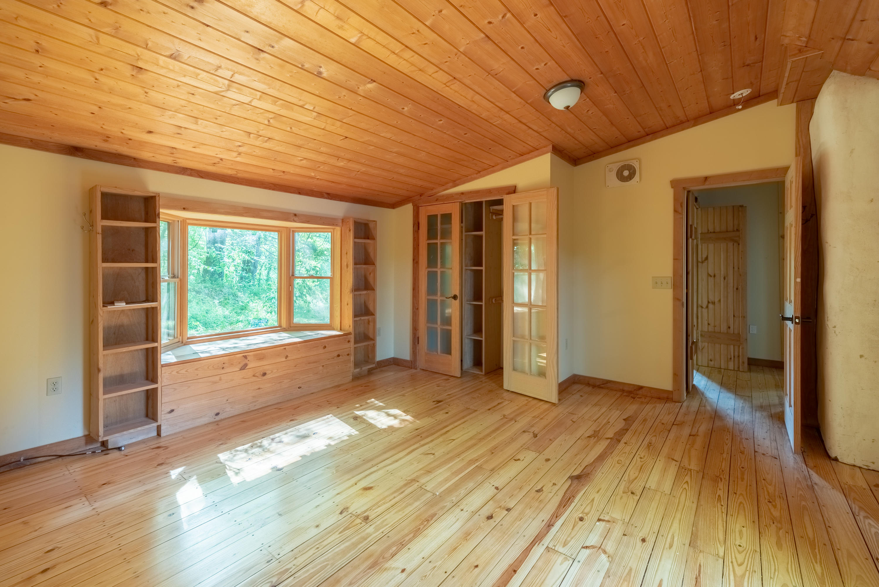 483 Eanes Road Northeast Check, VA 24072 - Photo 16 of 31 a view of empty room with wooden floor and fan