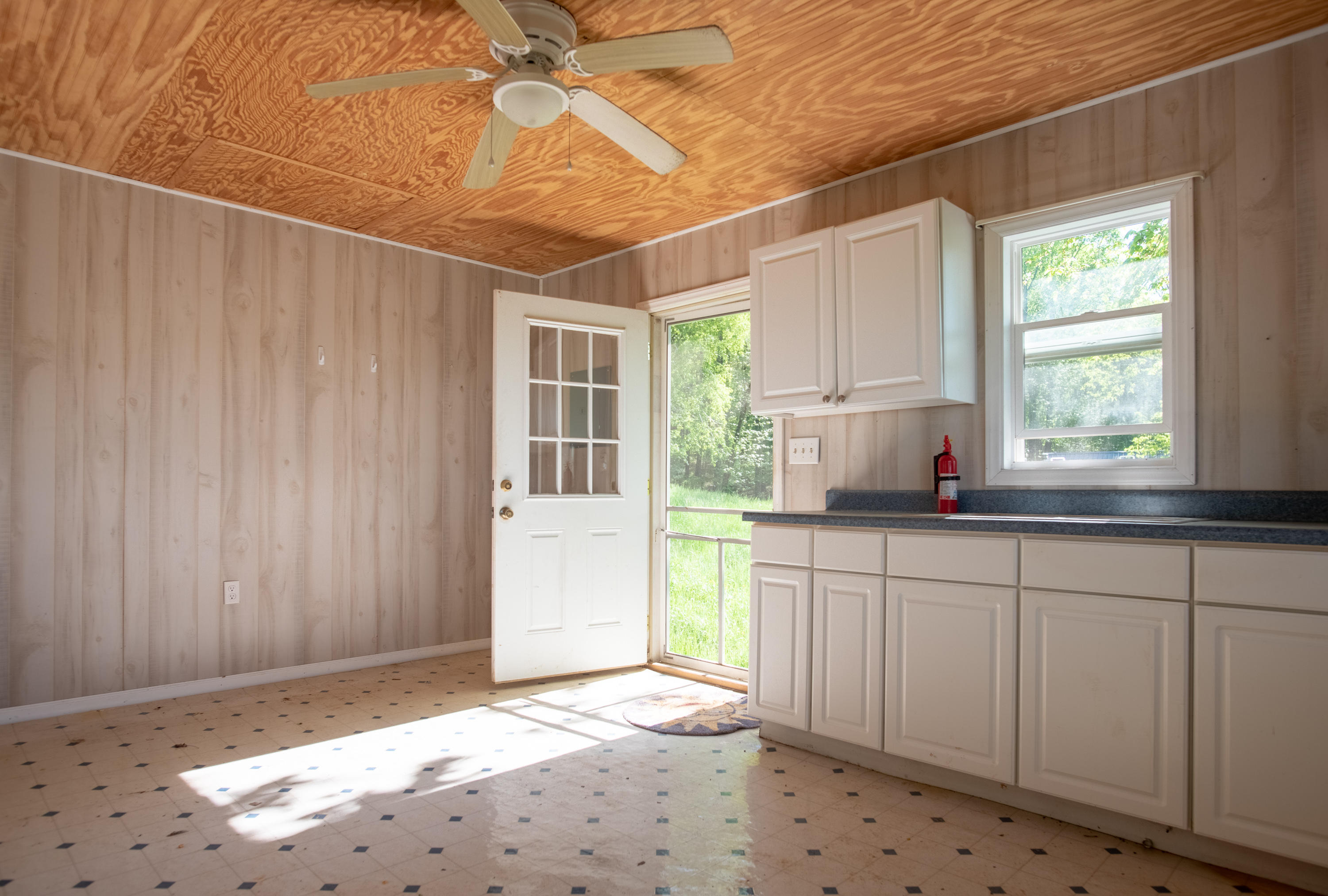 483 Eanes Road Northeast Check, VA 24072 - Photo 18 of 31 a kitchen with a sink window and cabinets