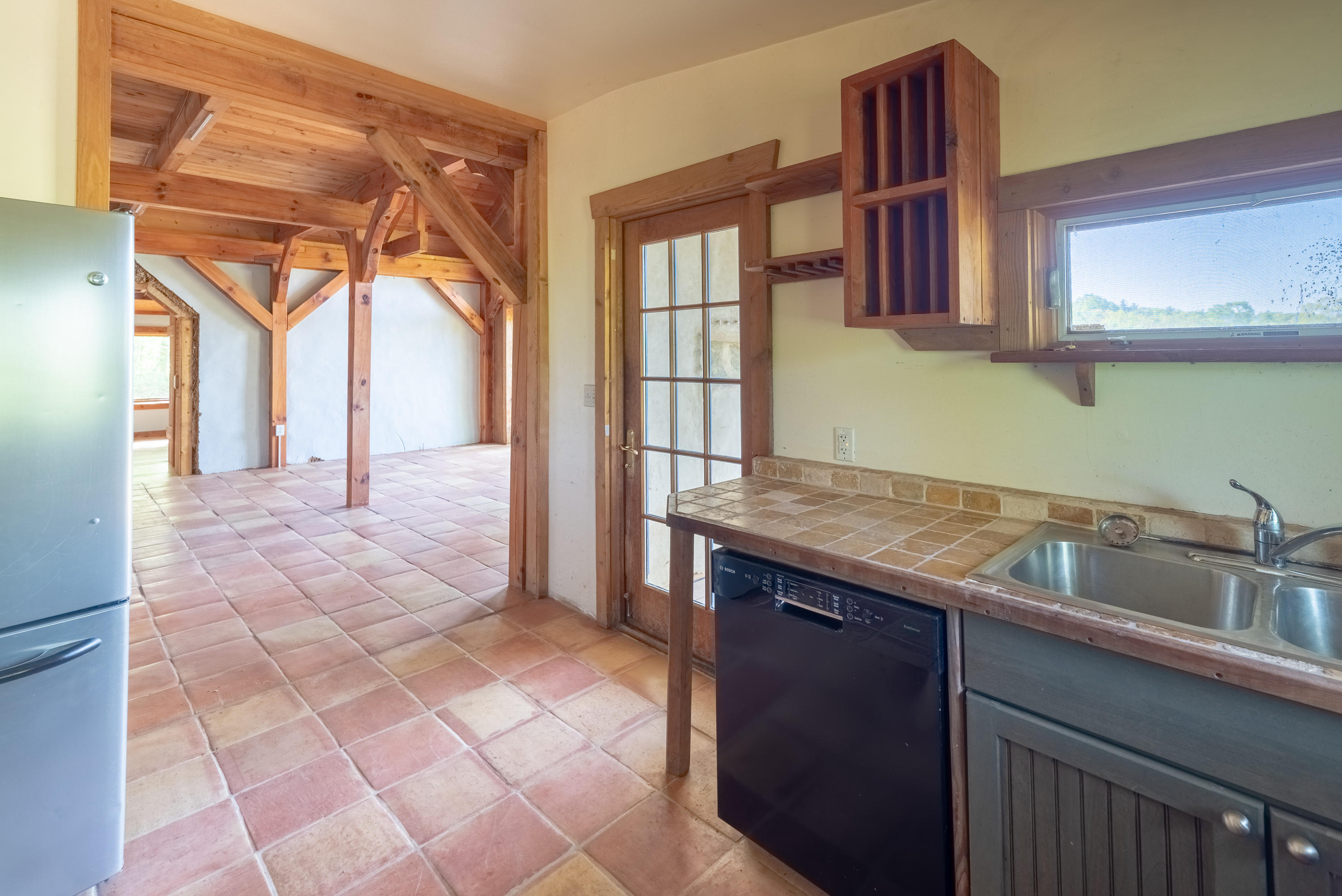 483 Eanes Road Northeast Check, VA 24072 - Photo 7 of 31 a kitchen with a sink a counter top space and cabinets