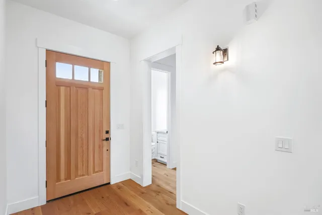 a bathroom with double vanity sink and a mirror