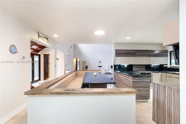 a view of a chairs and tables in backyard