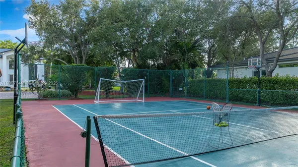 a view of a pathway along with potted plants