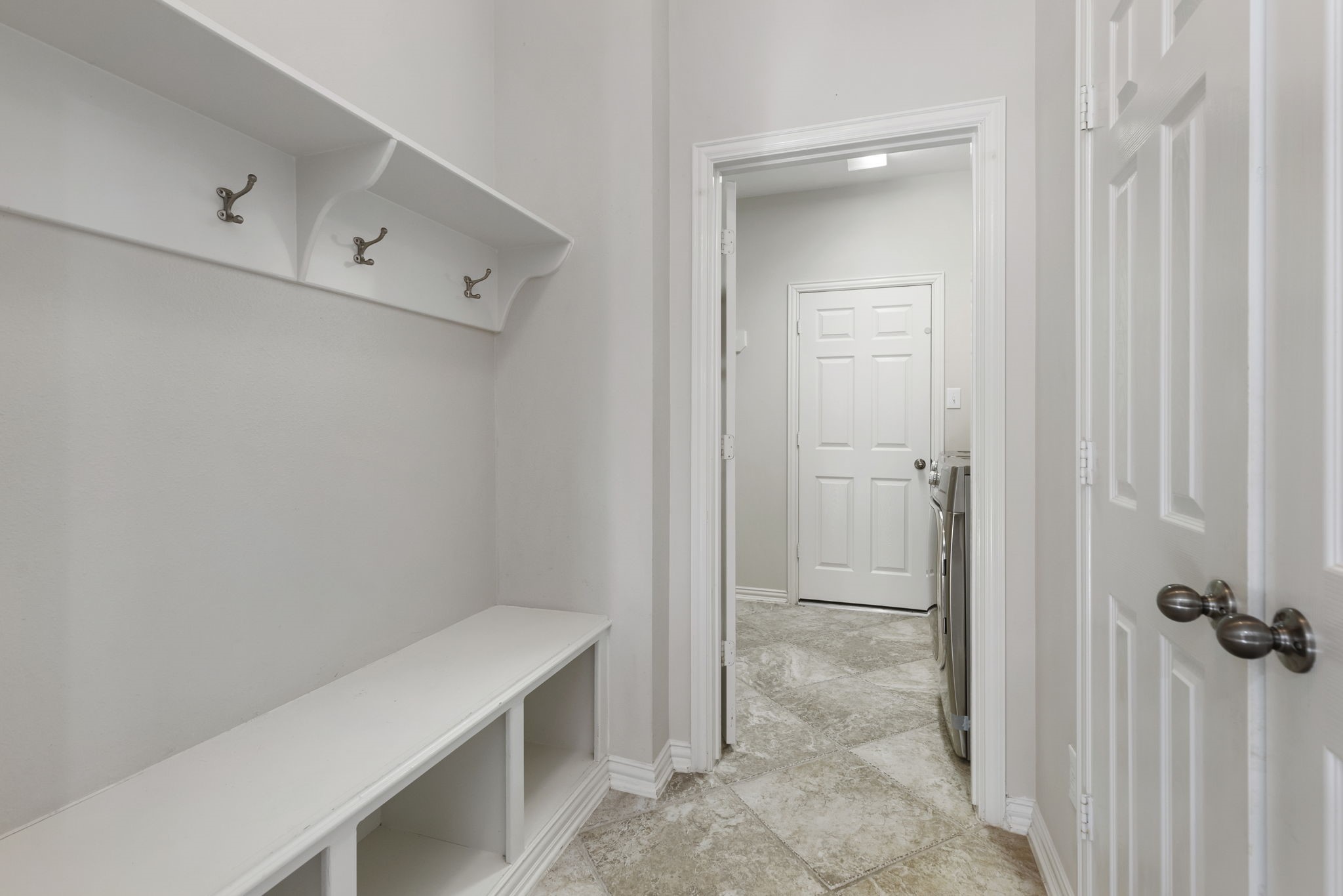 80 West Frontera Circle Spring, TX 77382 - Photo 12 of 28 Perfect mudroom with built-in storage leading into the laundry room.