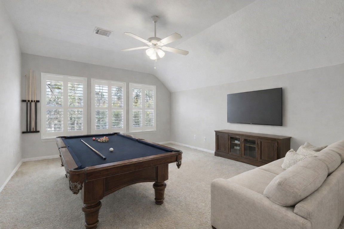 80 North Frontera Circle Spring, TX 77382 - Photo 18 of 28 a living room with furniture and a flat screen tv