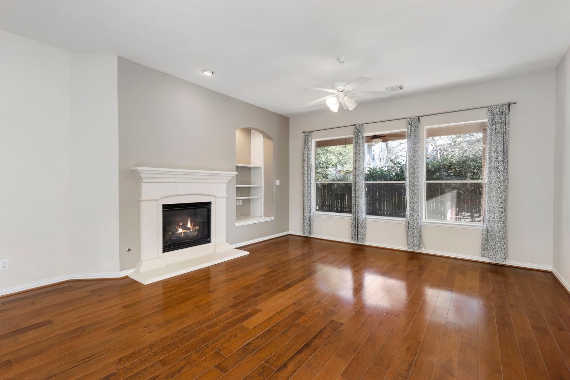 80 North Frontera Circle Spring, TX 77382 - Photo 10 of 28 a view of an empty room with wooden floor and a window