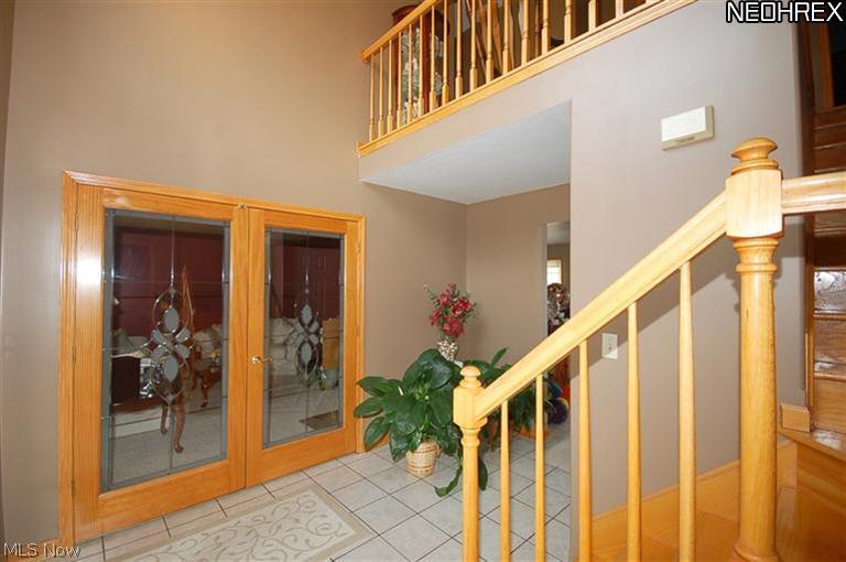 490 Airport Road Warren, OH 44481 - Photo 4 of 24 Two story foyer with beautiful french doors to living room.