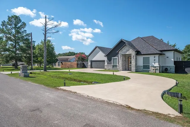 a view of house with yard and green space