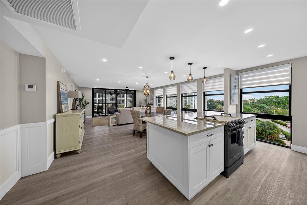 1629 Riverview Road, Unit 521 Deerfield Beach, FL 33441 - Photo 2 of 54 a kitchen with stainless steel appliances granite countertop a stove and a large window