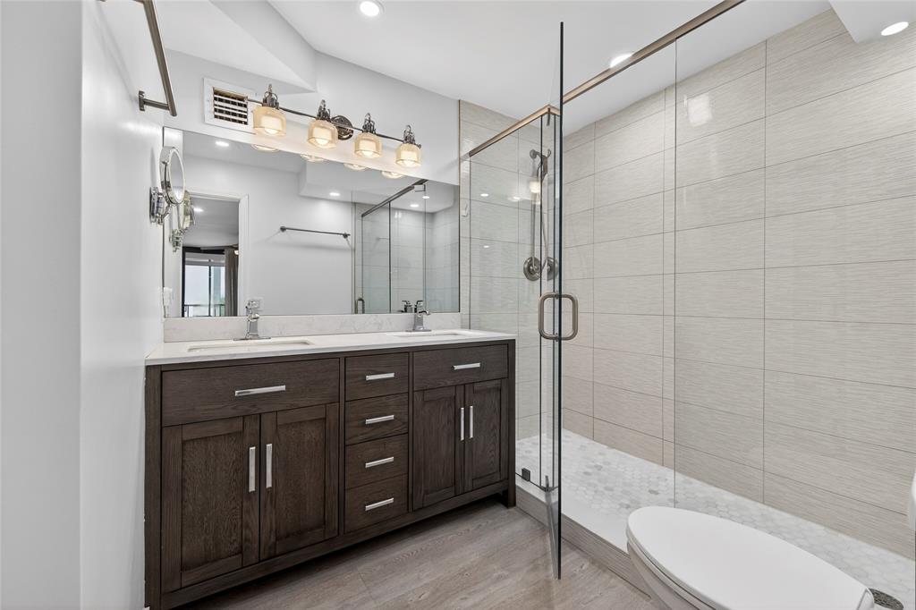 1629 Riverview Road, Unit 521 Deerfield Beach, FL 33441 - Photo 21 of 54 a bathroom with a double vanity sink mirror and toilet