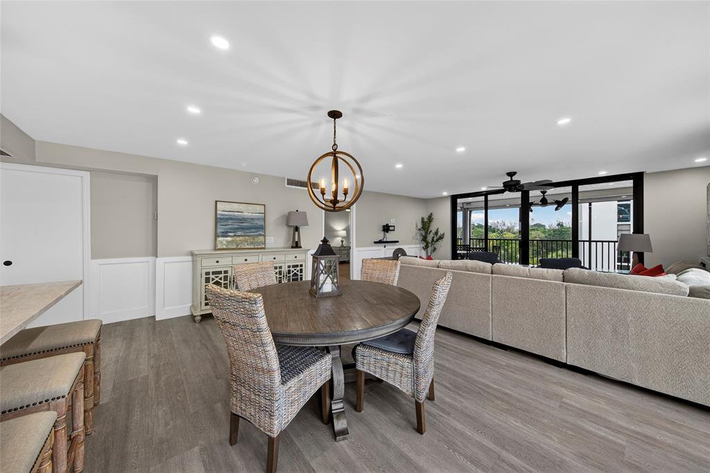 1629 Riverview Road, Unit 521 Deerfield Beach, FL 33441 - Photo 34 of 54 a view of a dining room with furniture window and wooden floor