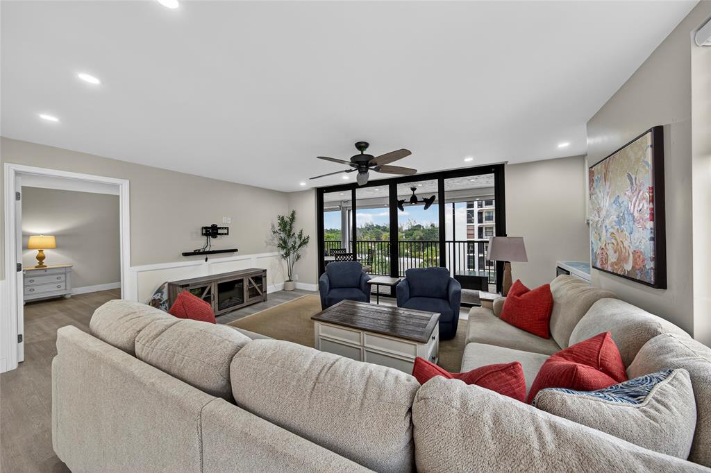 1629 Riverview Road, Unit 521 Deerfield Beach, FL 33441 - Photo 38 of 54 a living room with furniture fireplace and a large window