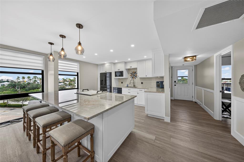 1629 Riverview Road, Unit 521 Deerfield Beach, FL 33441 - Photo 4 of 54 a living room with furniture and a flat screen tv