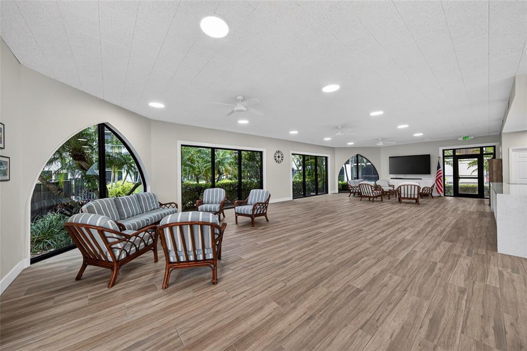 1629 Riverview Road, Unit 521 Deerfield Beach, FL 33441 - Photo 43 of 54 a living room with furniture and a wooden floor