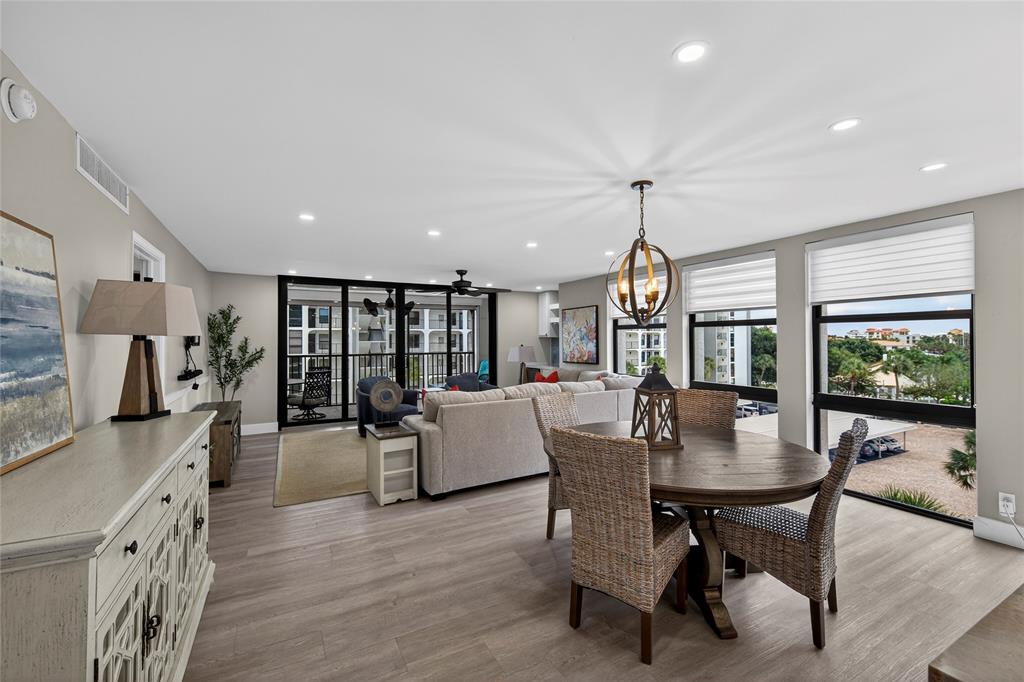 1629 Riverview Road, Unit 521 Deerfield Beach, FL 33441 - Photo 5 of 54 a dining room with furniture window wooden floor
