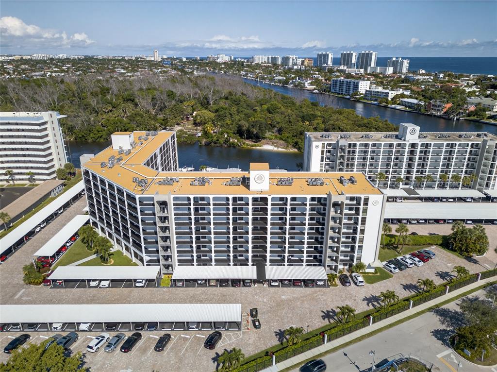 1629 Riverview Road, Unit 521 Deerfield Beach, FL 33441 - Photo 51 of 54 a view of roof deck with wooden floor and city view