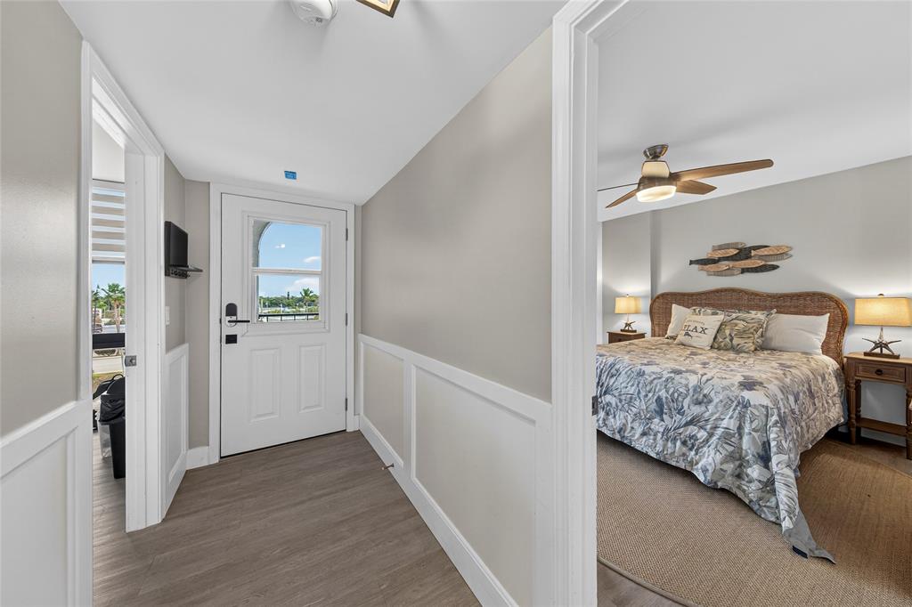 1629 Riverview Road, Unit 521 Deerfield Beach, FL 33441 - Photo 6 of 54 a bedroom with a bed and a view of bathroom