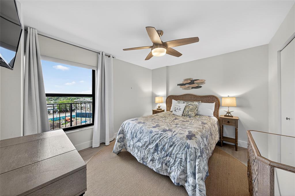 1629 Riverview Road, Unit 521 Deerfield Beach, FL 33441 - Photo 7 of 54 a bedroom with a large bed and a large window
