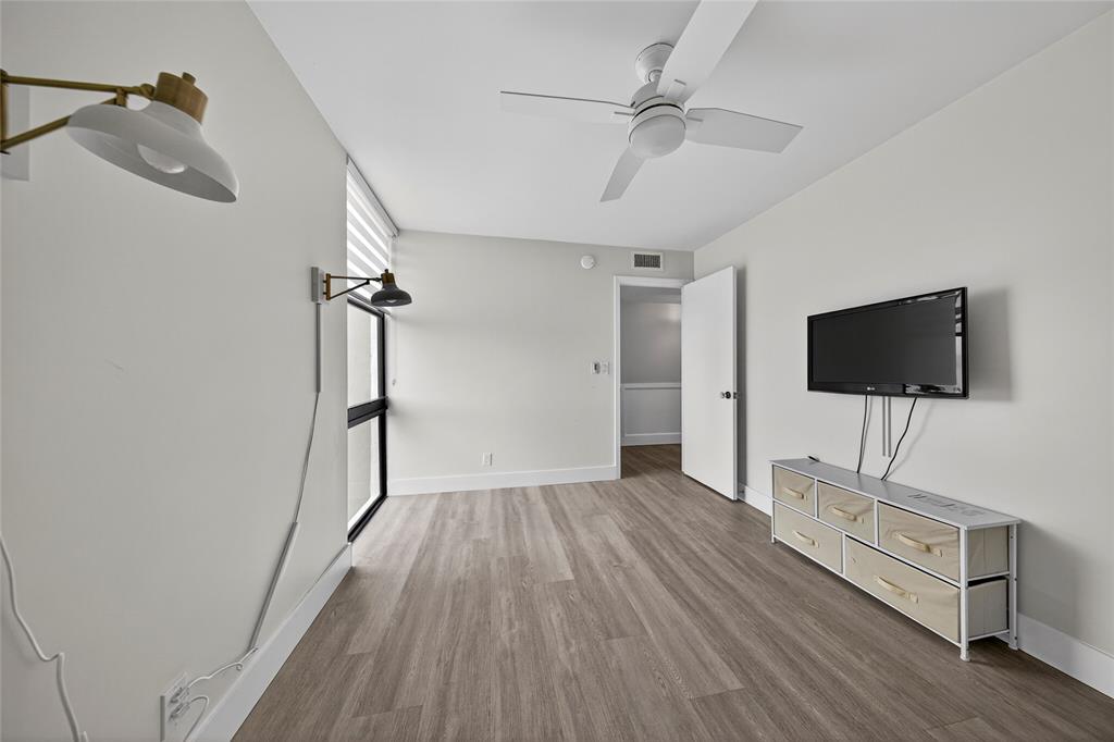 1629 Riverview Road, Unit 521 Deerfield Beach, FL 33441 - Photo 10 of 54 a view of a livingroom with wooden floor and staircase