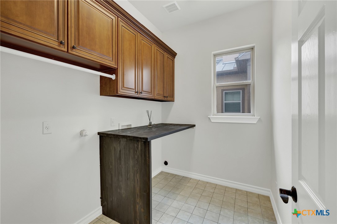 1029 Gruene Road New Braunfels, TX 78130 - Photo 17 of 48 a kitchen with stainless steel appliances granite countertop a sink and cabinets with wooden floor