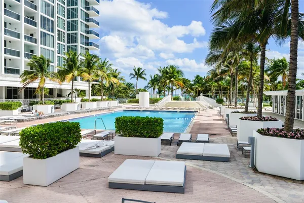 a view of a patio with couches and a fire pit