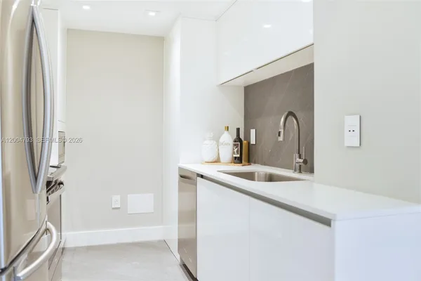 a bathroom with a sink and mirror