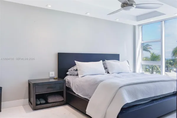 a bedroom with a bed and a fireplace