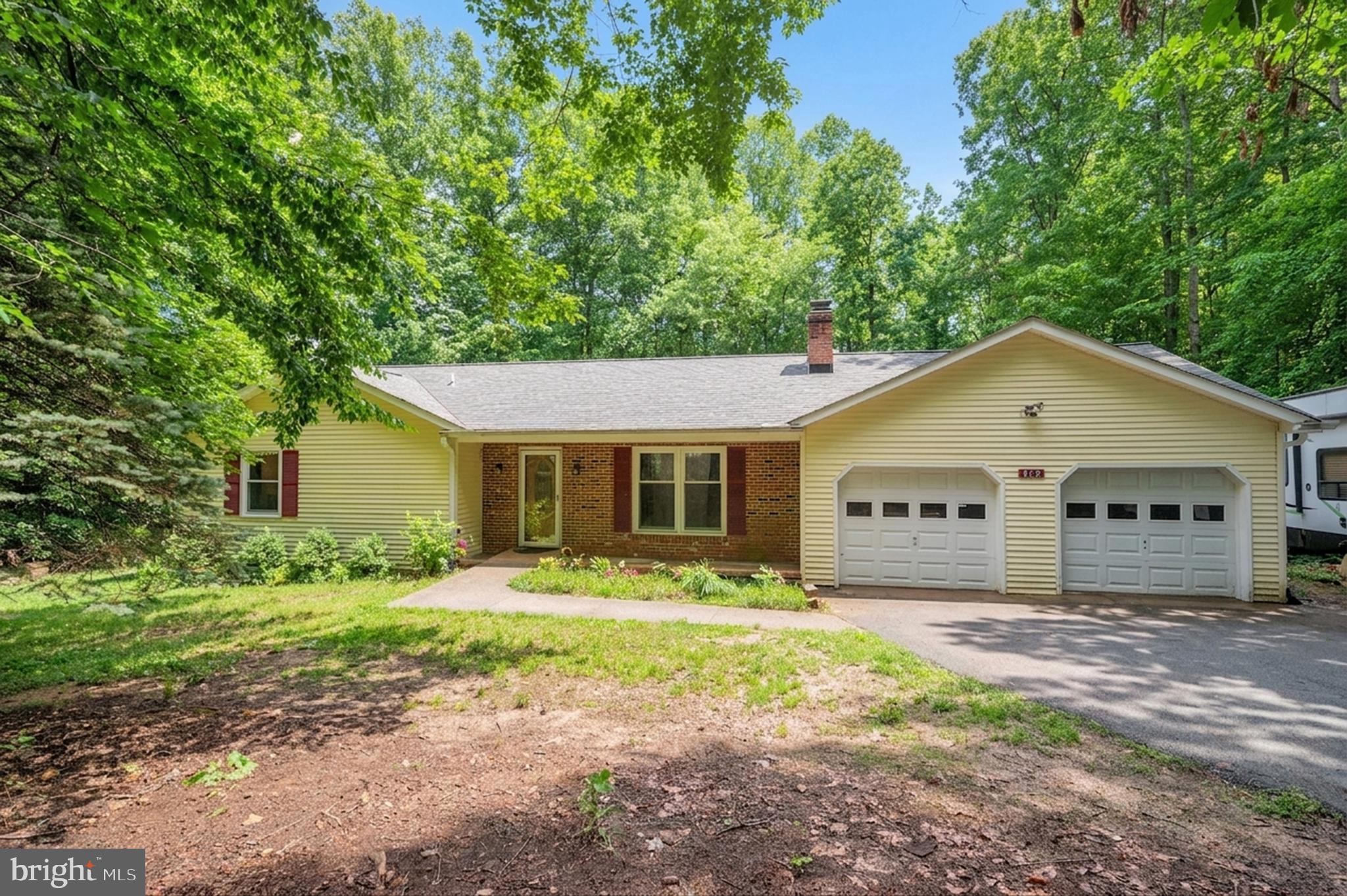 679 Cropp Road Fredericksburg, VA 22406 - Photo 2 of 39 a front view of a house with yard