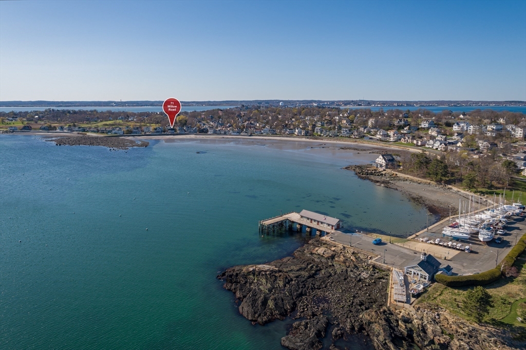 an aerial view of a house with a lake view