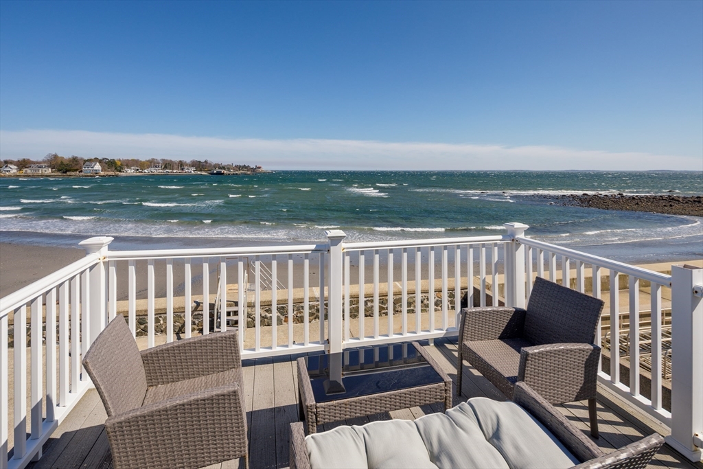71 Willow Road Nahant, MA 01908 - Photo 2 of 30 a view of a balcony with wooden floor and outdoor space