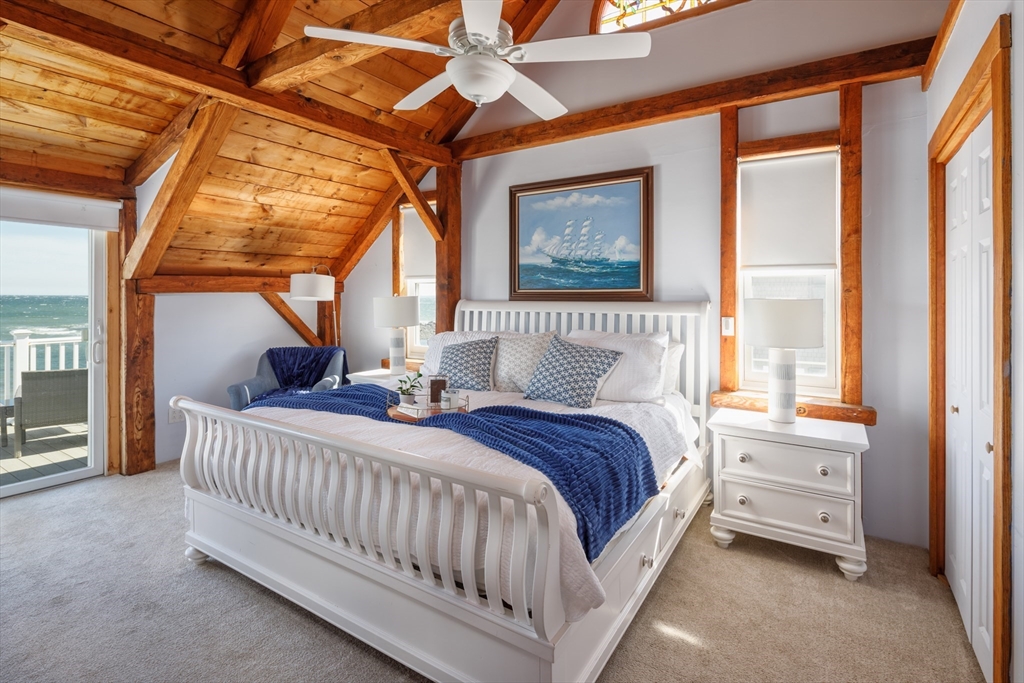 71 Willow Road Nahant, MA 01908 - Photo 23 of 30 a bedroom with a bed a large window with the outer view