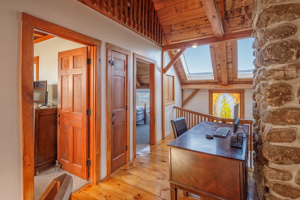 71 Willow Road Nahant, MA 01908 - Photo 24 of 30 a view of a hallway with a dining table & chairs