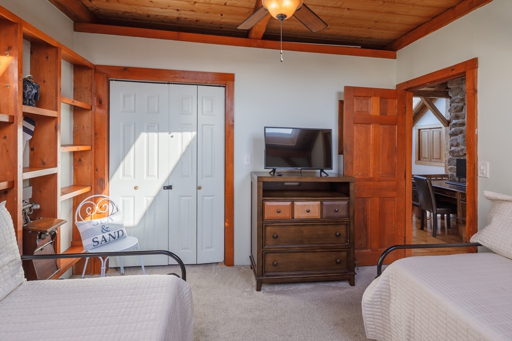 71 Willow Road Nahant, MA 01908 - Photo 28 of 30 a bedroom with a bed and wooden floor