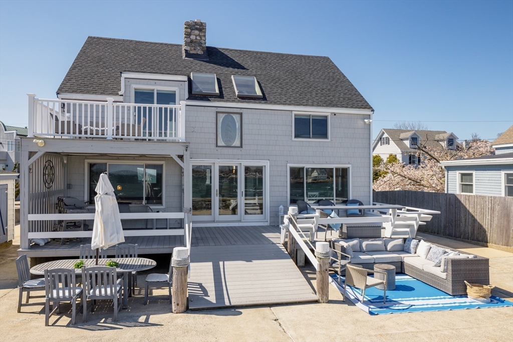 71 Willow Road Nahant, MA 01908 - Photo 7 of 30 a front view of a house with glass windows