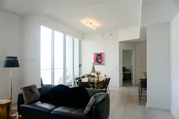 a living room with furniture and a window