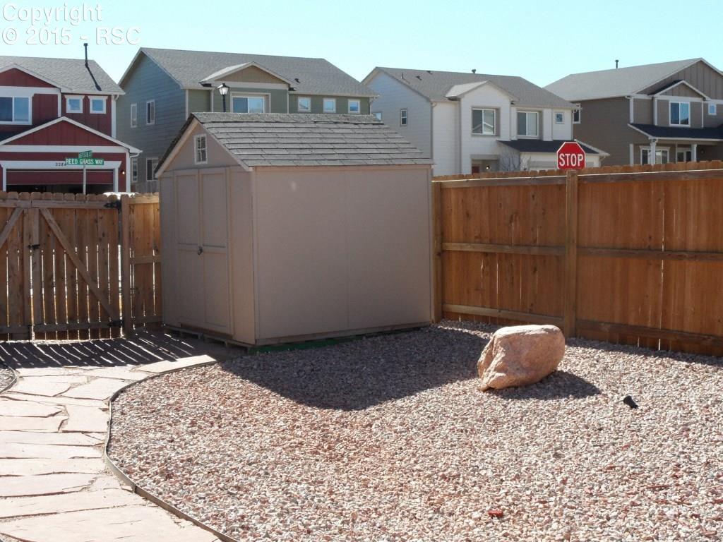 2275 Reed Grass Way Colorado Springs, CO 80915 - Photo 22 of 24 Storage shed and newer fence