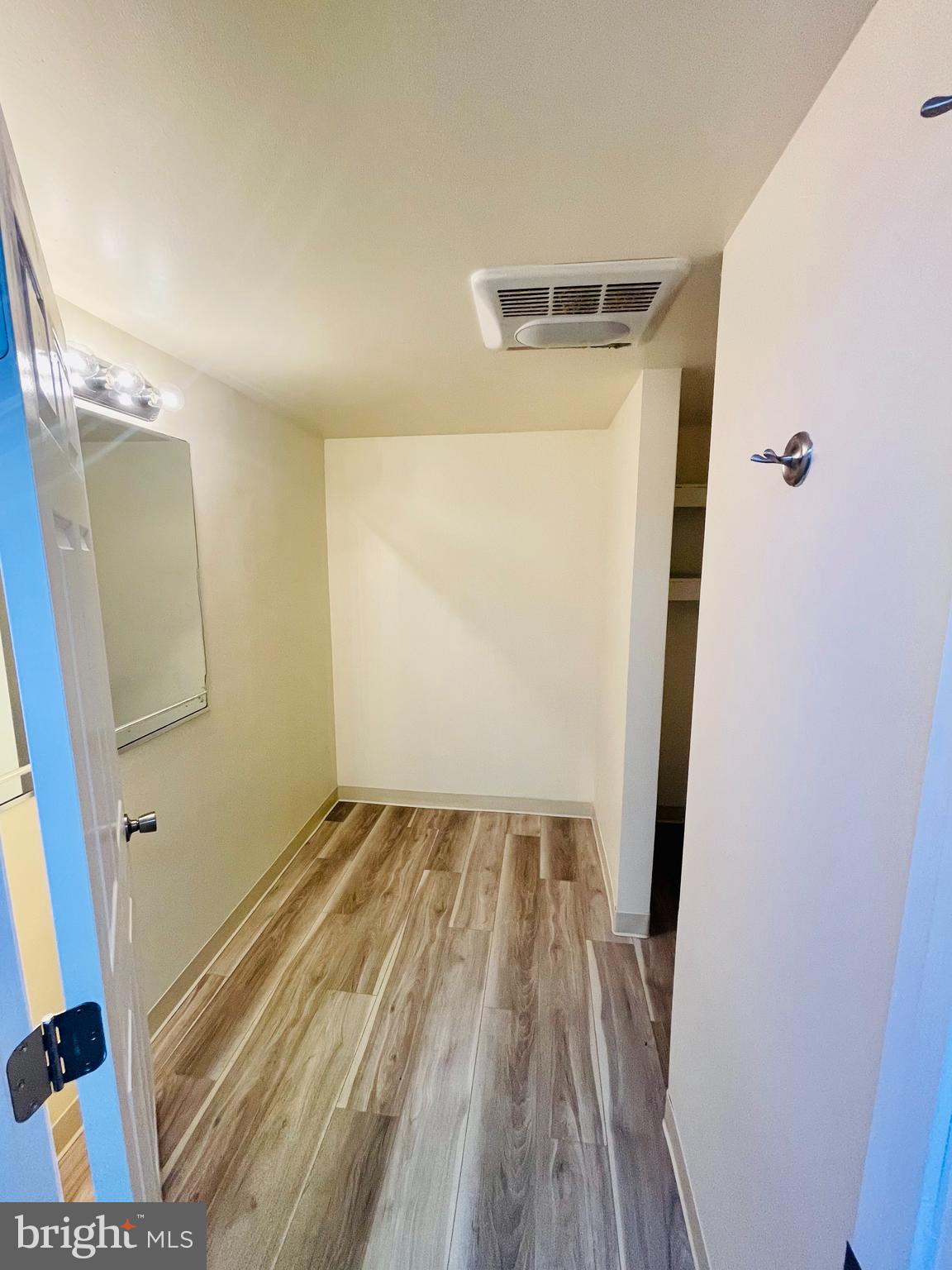 26540 Deal Island Road Princess Anne, MD 21853 - Photo 61 of 76 a view of a room with wooden floor and staircase