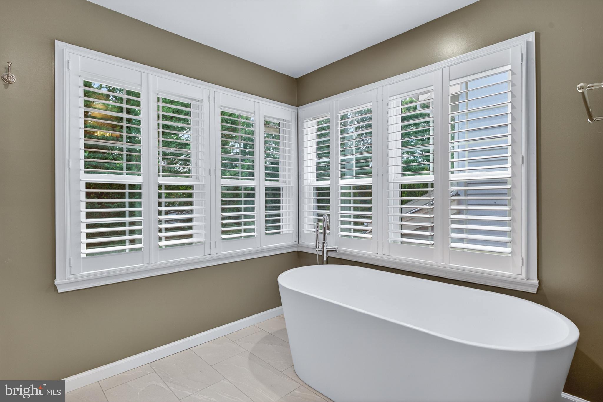 6 Nearfield Road Lutherville-Timonium, MD 21093 - Photo 44 of 71 a bathroom with a bathtub and window