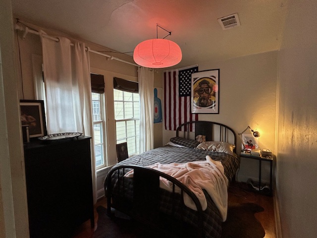 906 West 22nd Street, Unit 4 Austin, TX 78705 - Photo 4 of 7 a bedroom with a bed and a closet