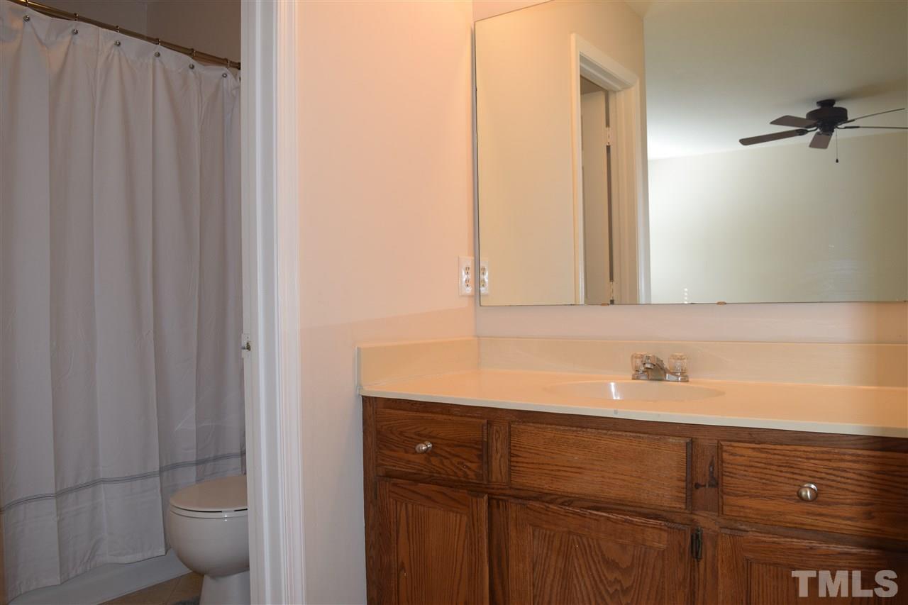 4404 Lake Ridge Drive Raleigh, NC 27604 - Photo 13 of 24 a bathroom with a sink and a mirror
