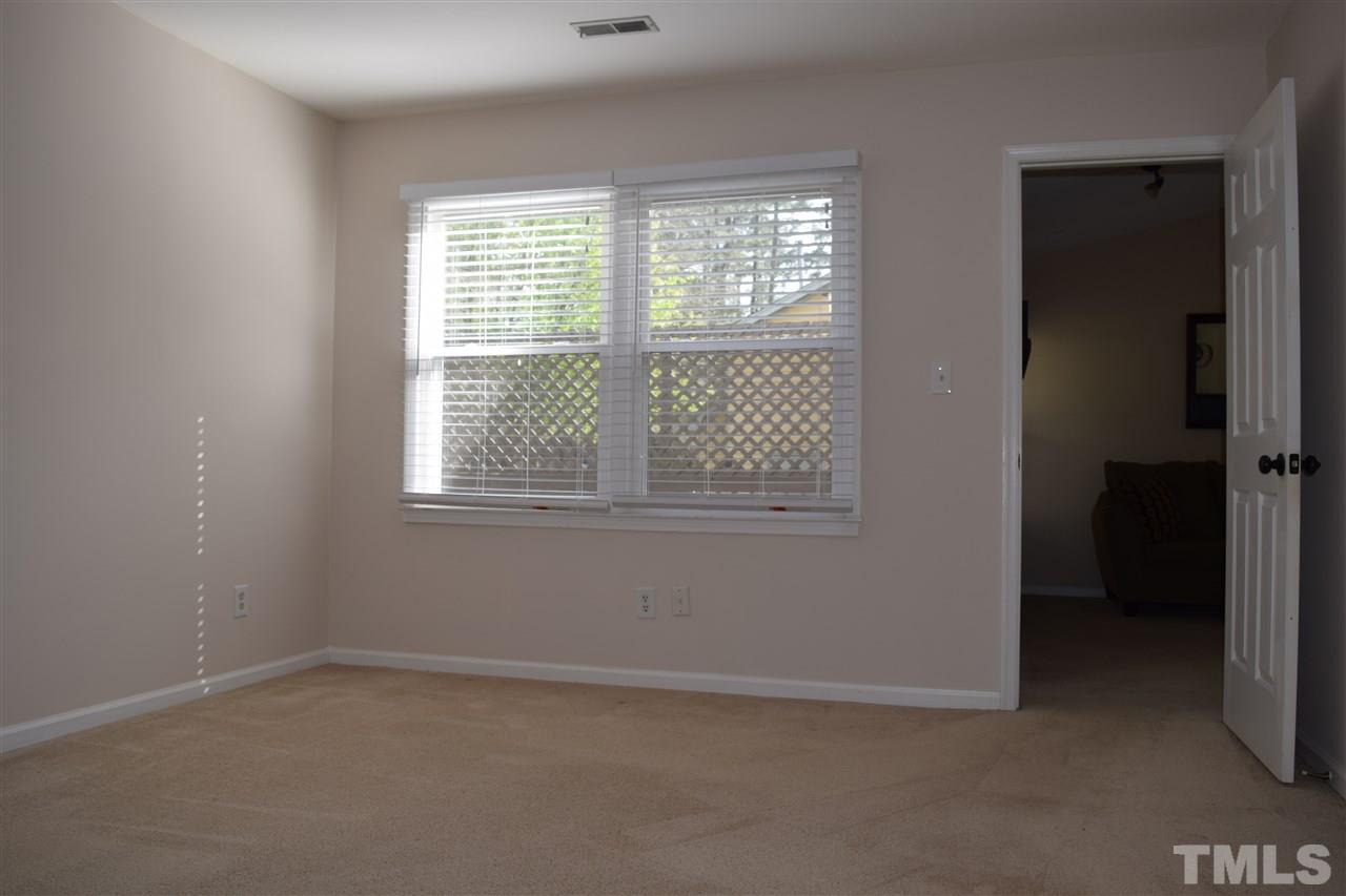 4404 Lake Ridge Drive Raleigh, NC 27604 - Photo 14 of 24 an empty room with windows
