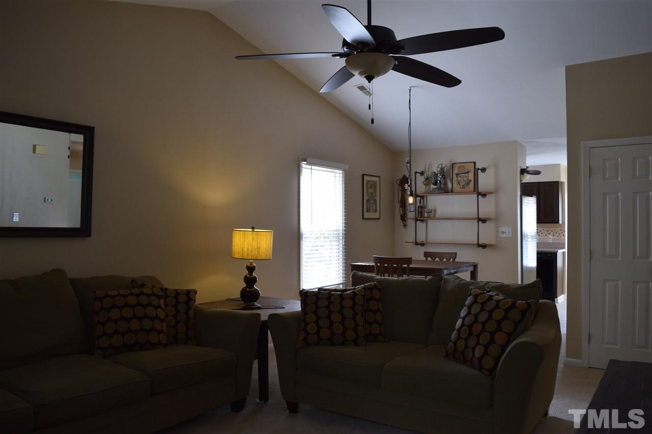 4404 Lake Ridge Drive Raleigh, NC 27604 - Photo 15 of 24 a living room with furniture and a lamp