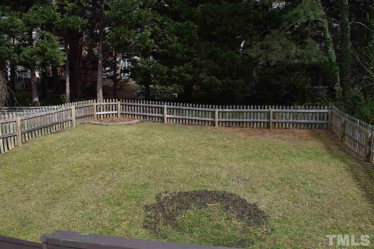 4404 Lake Ridge Drive Raleigh, NC 27604 - Photo 19 of 24 a view of a yard with wooden fence