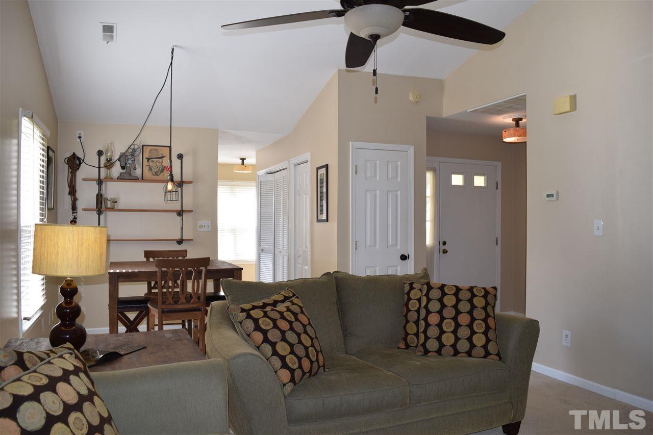 4404 Lake Ridge Drive Raleigh, NC 27604 - Photo 21 of 24 a living room with furniture and a chandelier