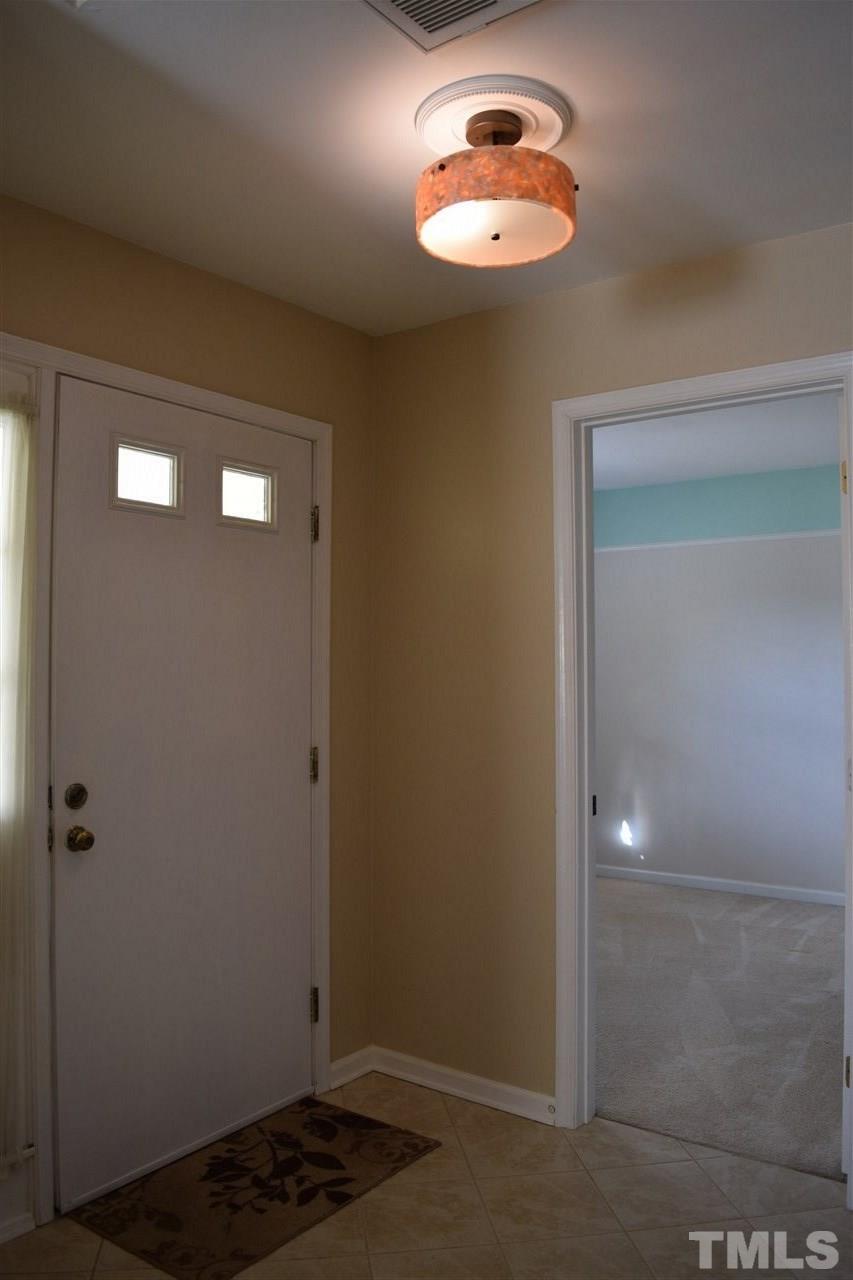 4404 Lake Ridge Drive Raleigh, NC 27604 - Photo 22 of 24 a view of an empty room with a window