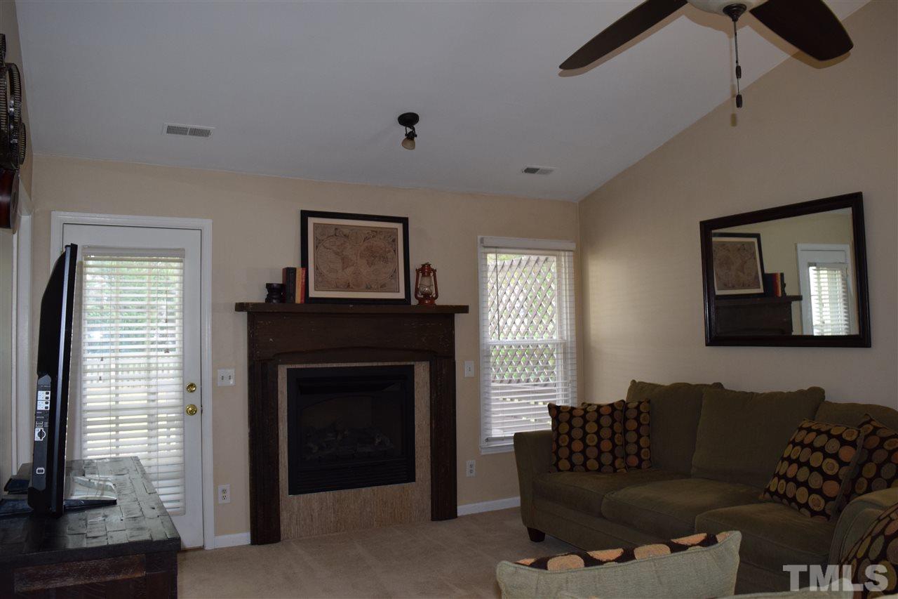 4404 Lake Ridge Drive Raleigh, NC 27604 - Photo 9 of 24 a living room with furniture and a fireplace